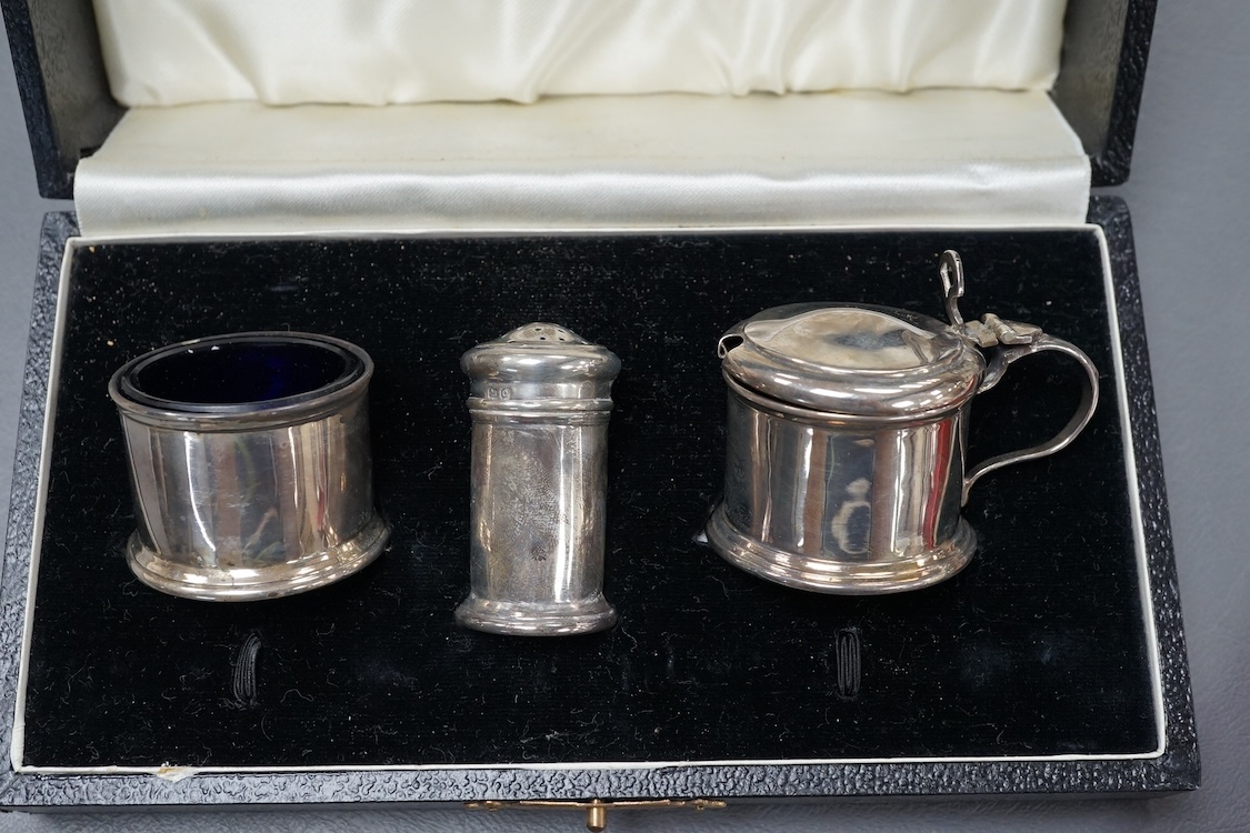 An Elizabeth II cased silver miniature silver four piece tea and coffee set and tray, by Bishton's Ltd, Birmingham, 1977/8, together with an earlier cased silver three piece condiment set.